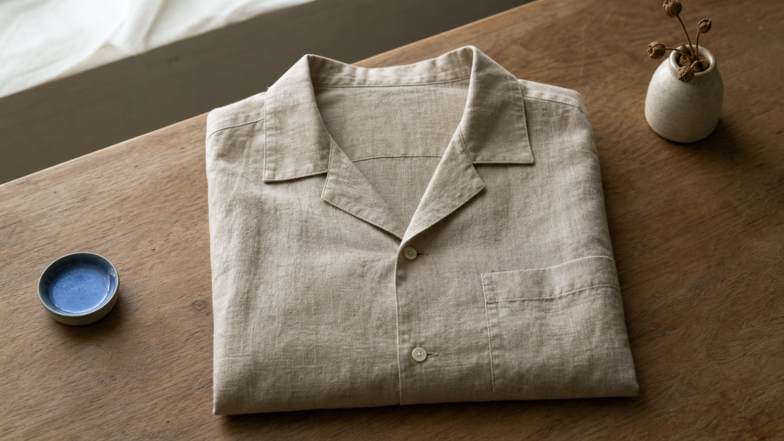 A flat camp collar shirt showing its open notch collar and single chest pocket.