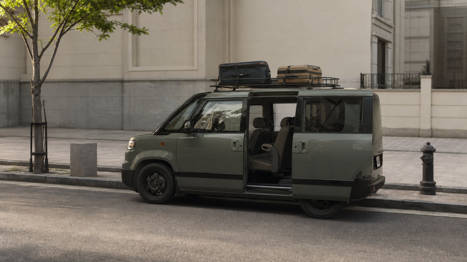 A boxy seven-seat van parked at a curb with its side doors open and suitcases strapped to the roof.