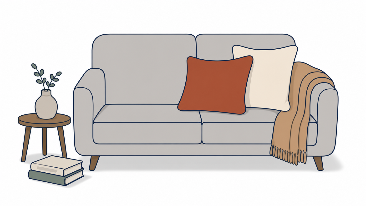 A rust wool pillow and a cream pillow rest on a light gray sofa with a camel throw over the arm.