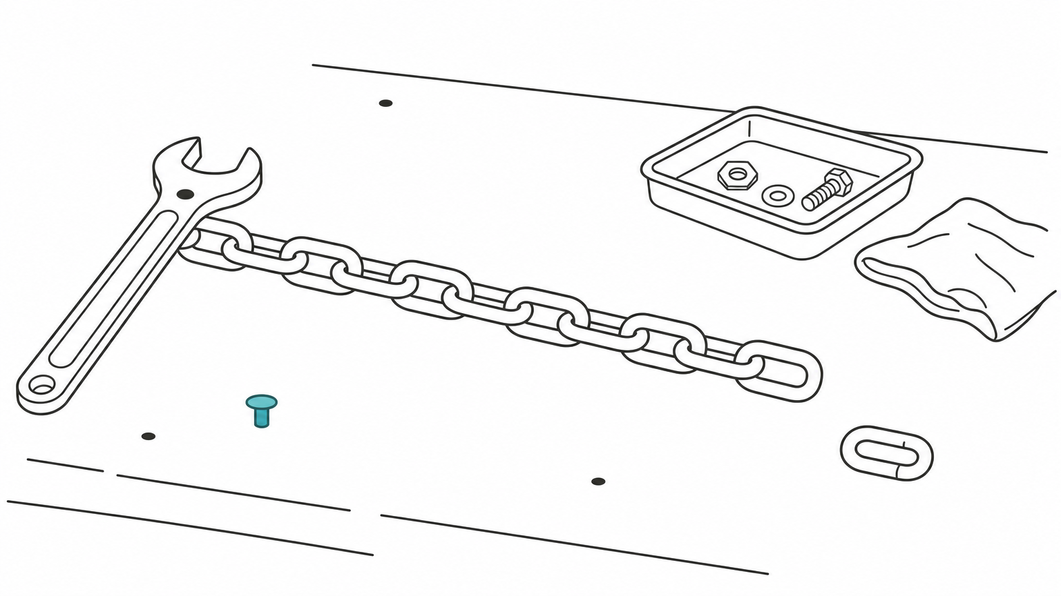 A long steel chain of linked links lying across a workbench beside a wrench.