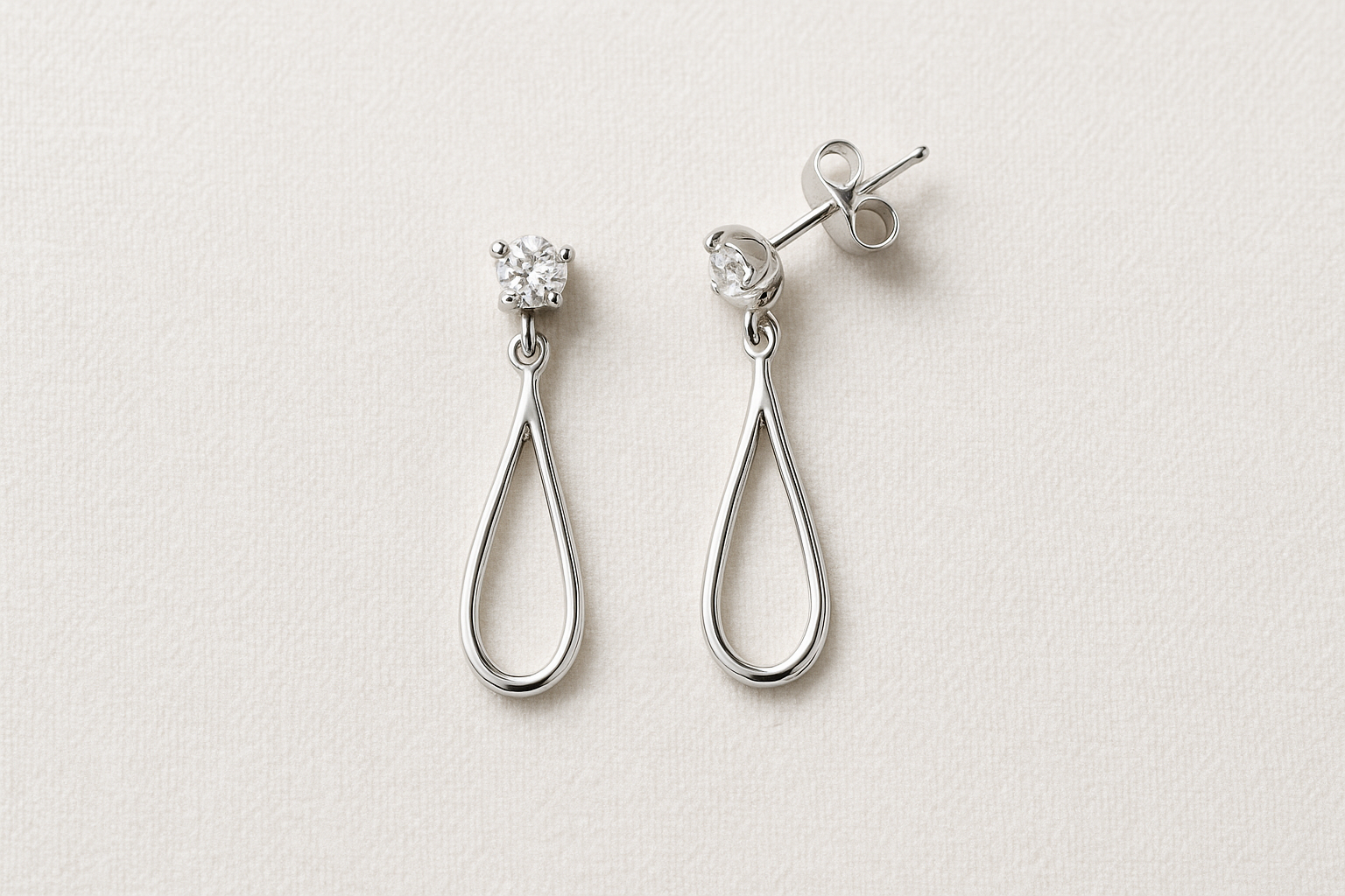 4. Silver or white gold earrings for year 25